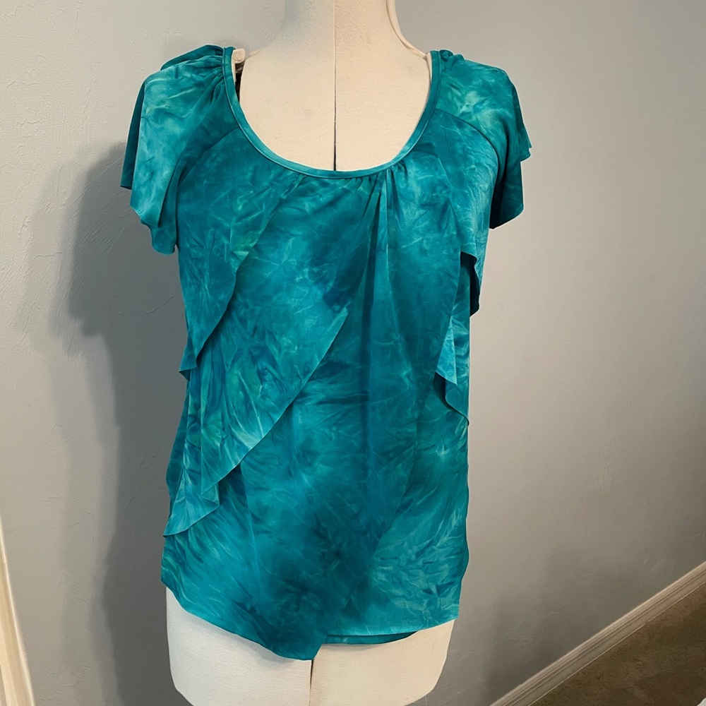 Silky fabric, hangs beautifully. Barely worn.